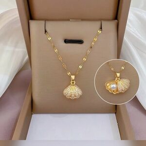 Gold Seashell Pendant Necklace with Accent Stones